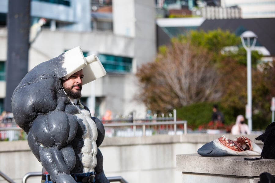 A man dressed as a muscle shark