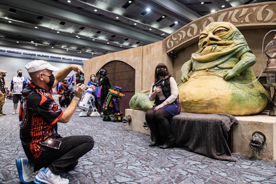People pose for a photo with Jabba the Hut at Fan Expo Canada 2021