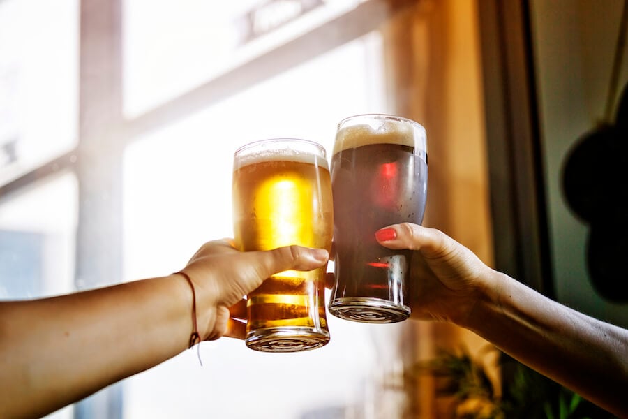 A celebratory beer toast