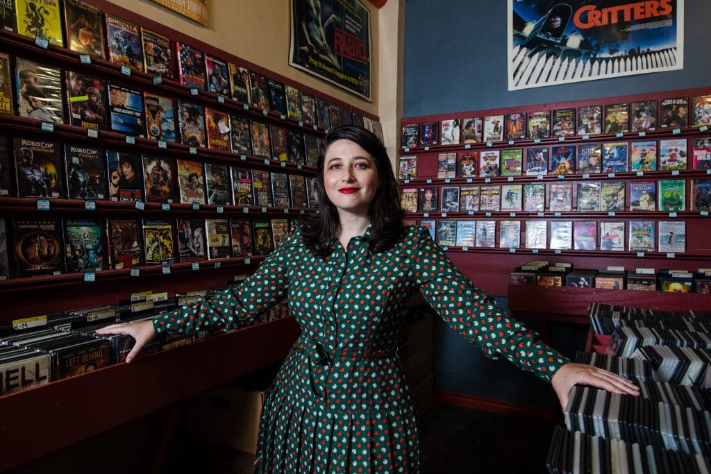 Chandler Levack takes in the wares at Eyesore Cinema while discussing her TIFF 2022 movie I Like Movies