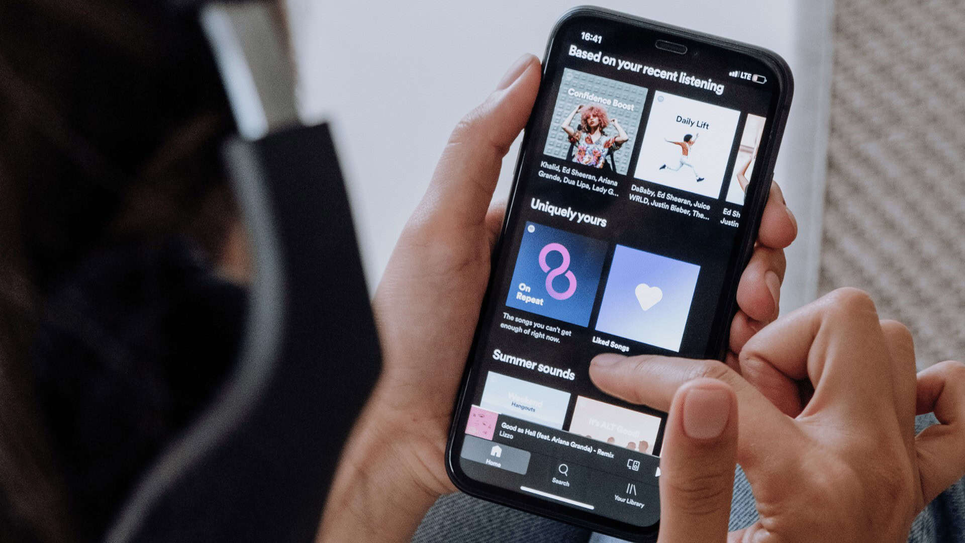 Music streaming app on smartphone showcasing personalized playlists and song recommendations for Toronto residents.