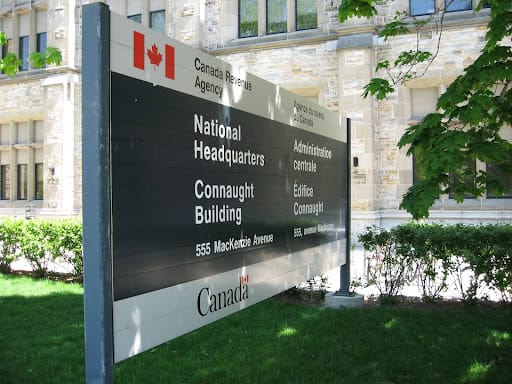 Canada Revenue Agency National Headquarters sign at Connaught Building, 555 MacKenzie Avenue, Ottawa, Ontario, Canada.