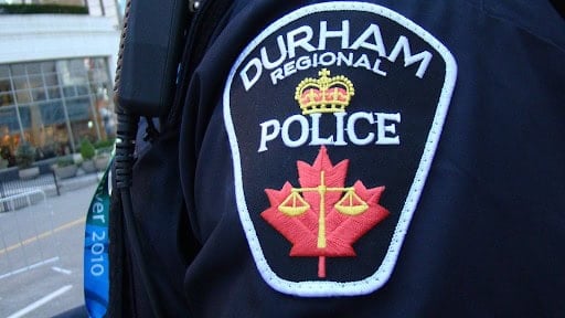 Durham Regional Police badge close-up showing law enforcement authority in Ontario, Canada.