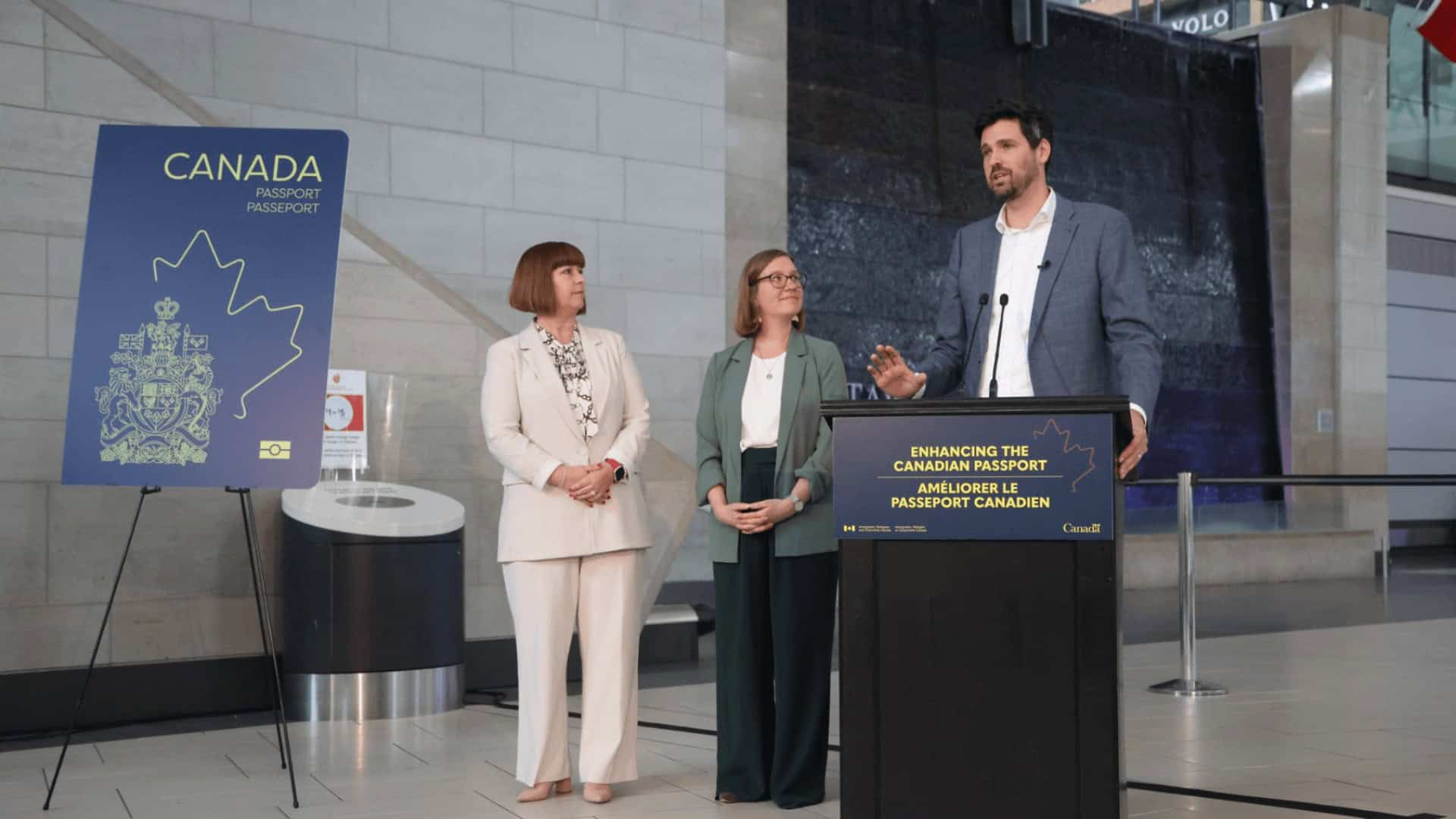 Canada passport promotion announcement at Toronto venue with officials and speaker.