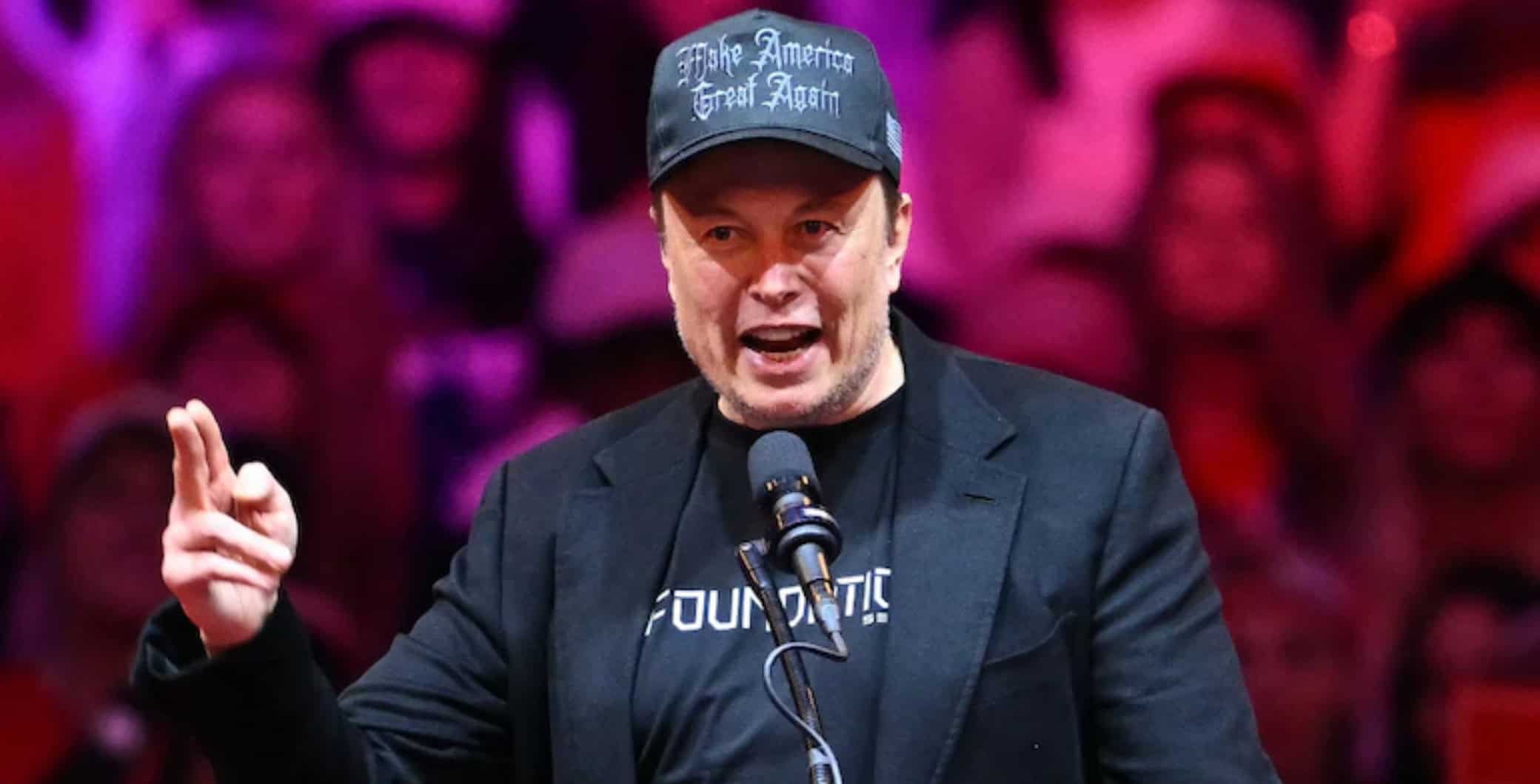 Vocalist passionately performing at a concert, wearing a black cap with the slogan "Make America Great Again," against a vibrant red and purple background.