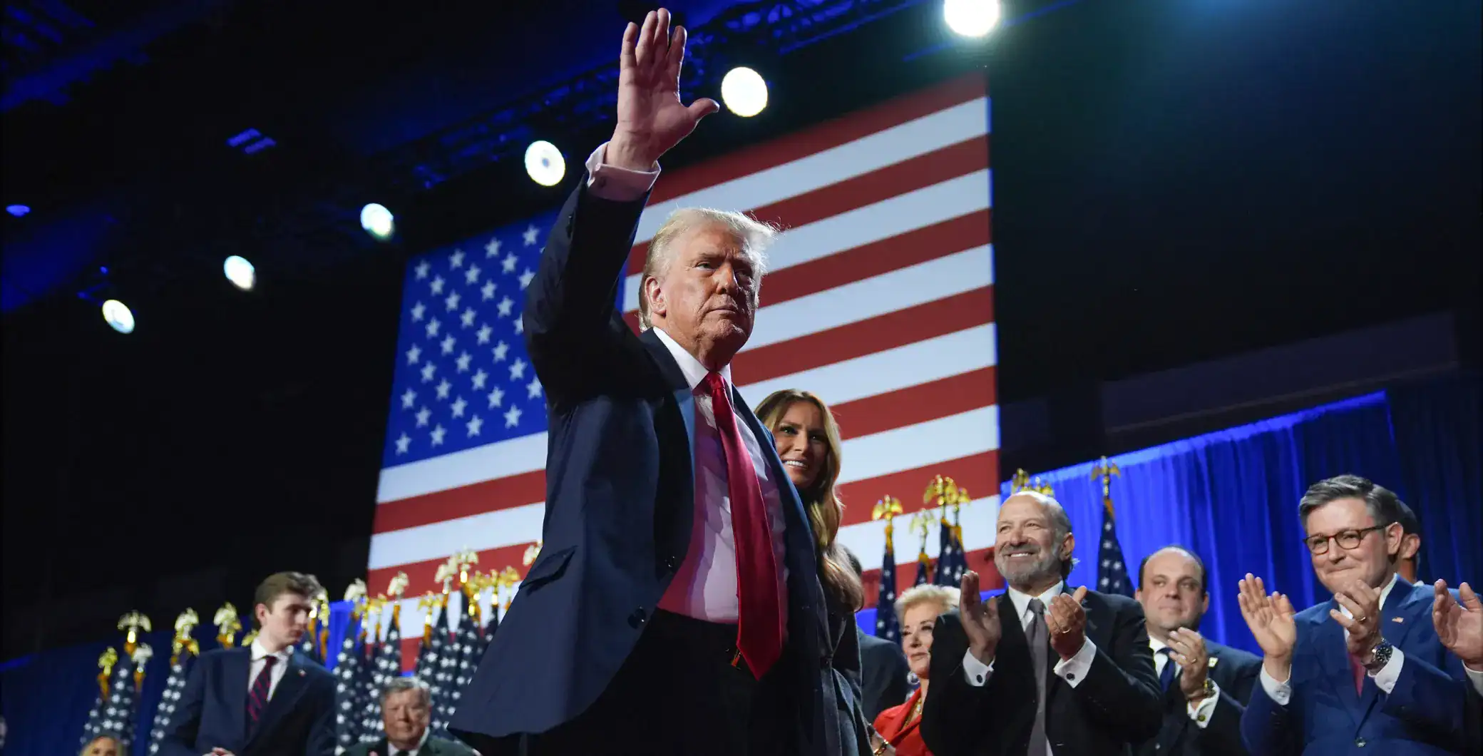 Donald Trump at a political rally in front of the American flag in Toronto, Ontario, Canada.