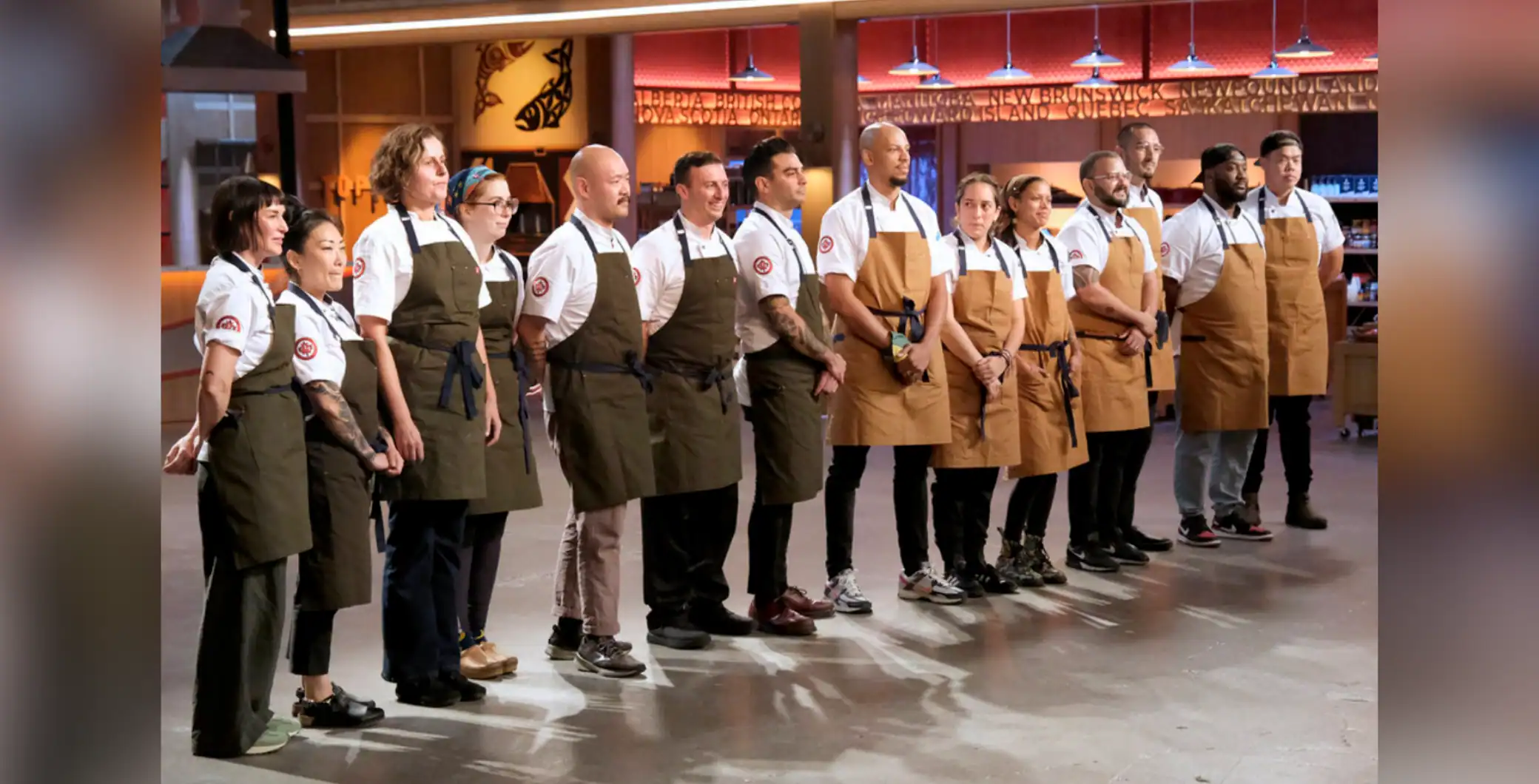 Diverse group of chefs and kitchen staff standing in formation at a Toronto restaurant, showcasing culinary teamwork, professionalism, and diversity in the Toronto culinary scene.