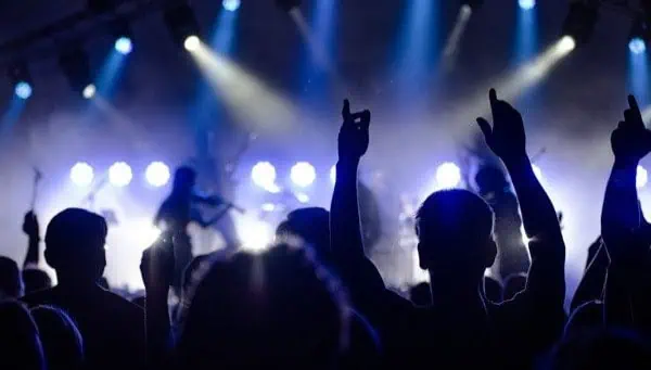 Crowd enjoying live music concert at a Toronto venue, vibrant stage lighting, energetic atmosphere, and concert experience in Downtown Toronto.