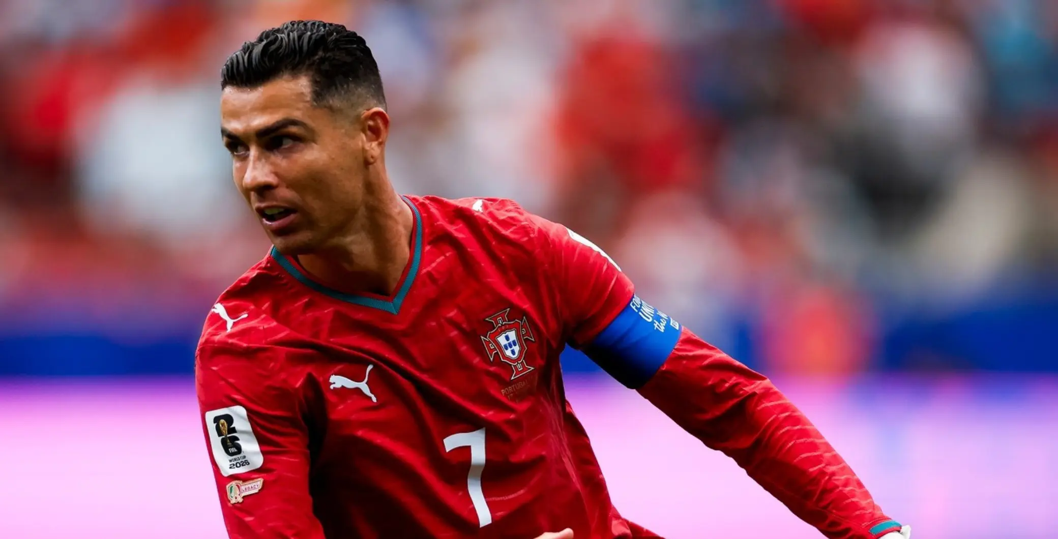 Cristiano Ronaldo in Portugal national team jersey during a match, showcasing his athleticism and focus on the field.