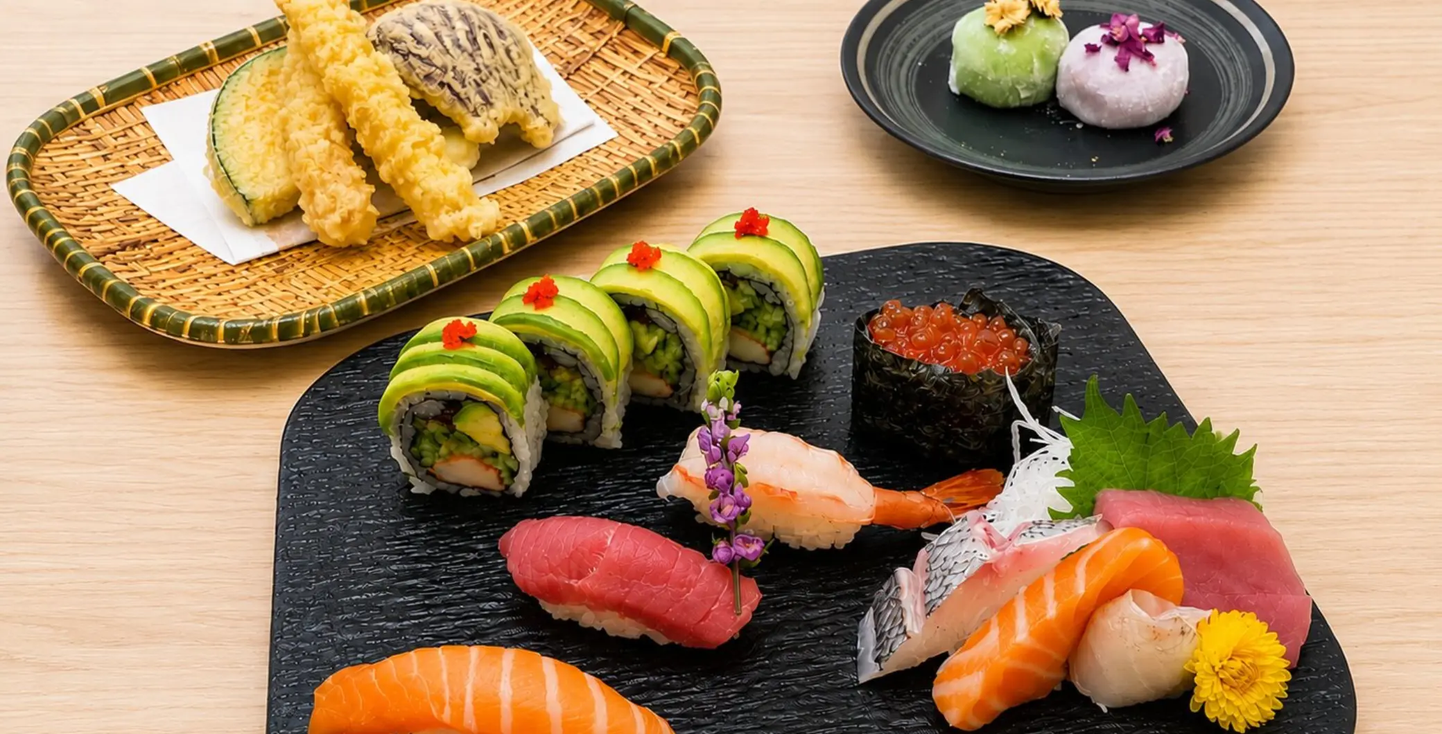 A variety of fresh sushi including sashimi, rolls, and tempura, showcasing Toronto's diverse culinary scene during Summerlicious.