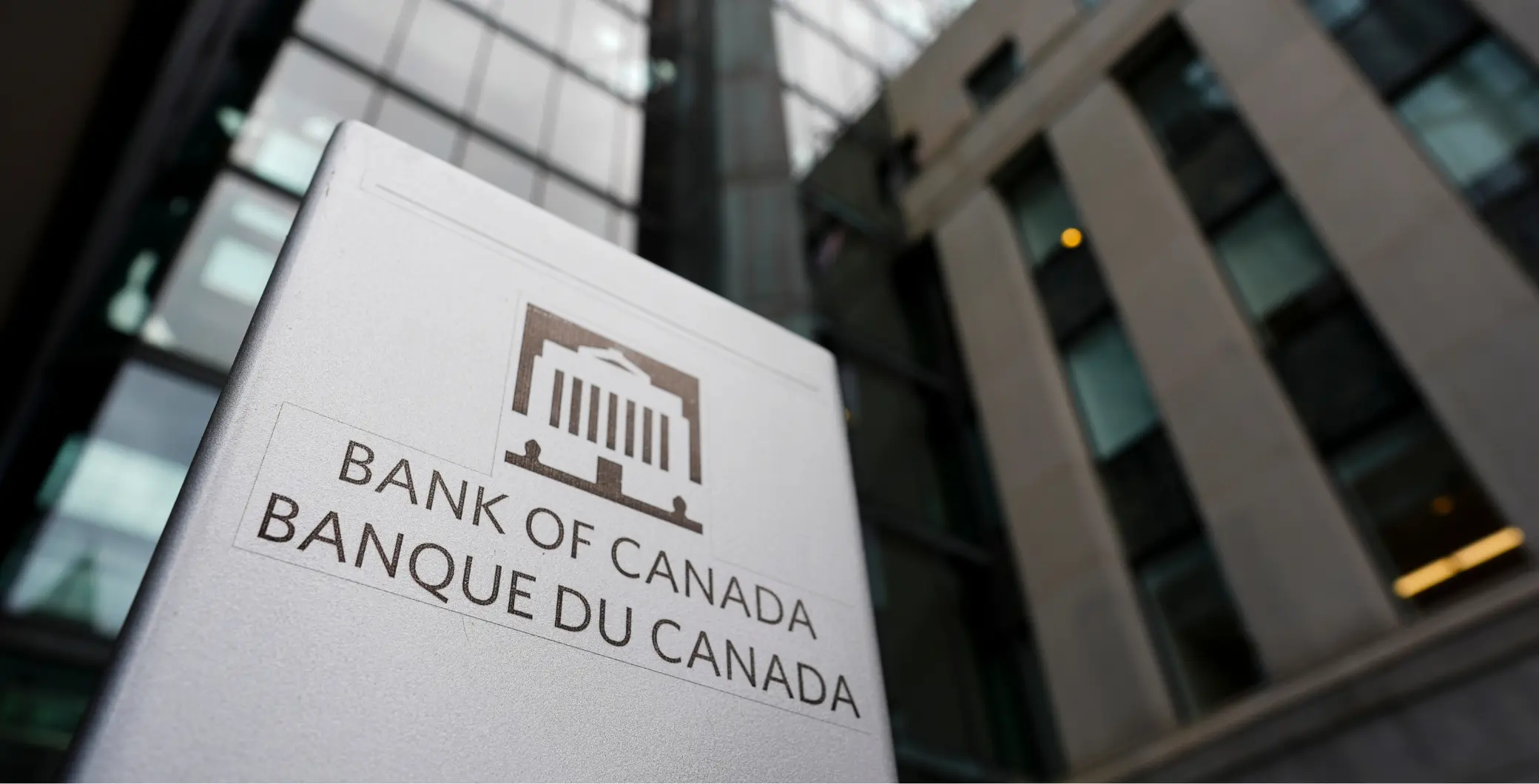 Bank of Canada sign outside a modern office building in Toronto, Canada, representing financial authority and economic policy.